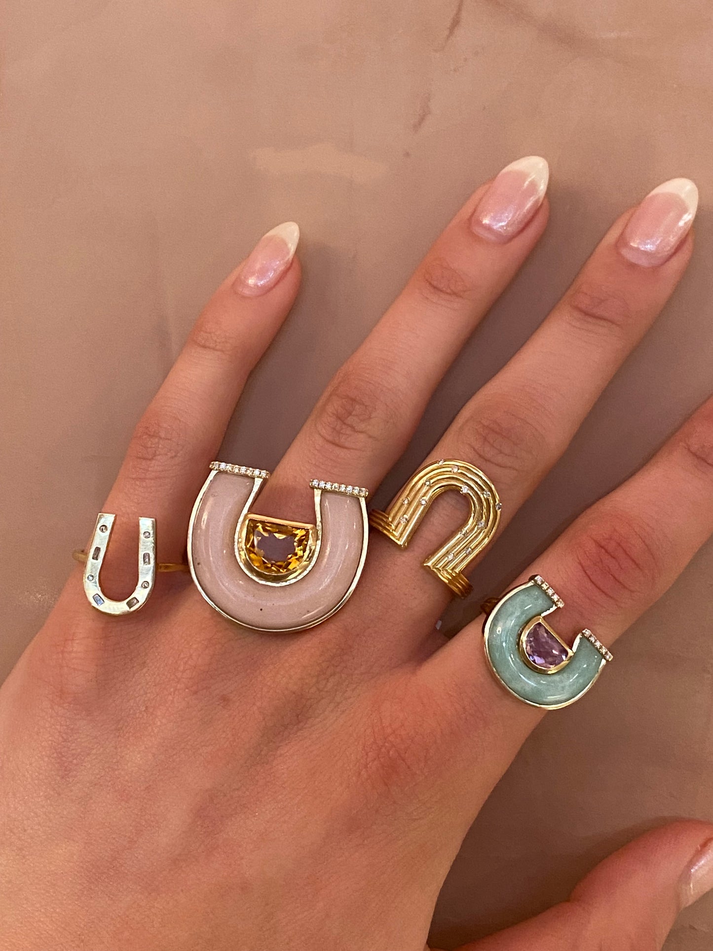 14K yellow gold horseshoe ring featuring jumbo citrine, pink opal gemstones, and diamond accents by Sig Ward Jewelry