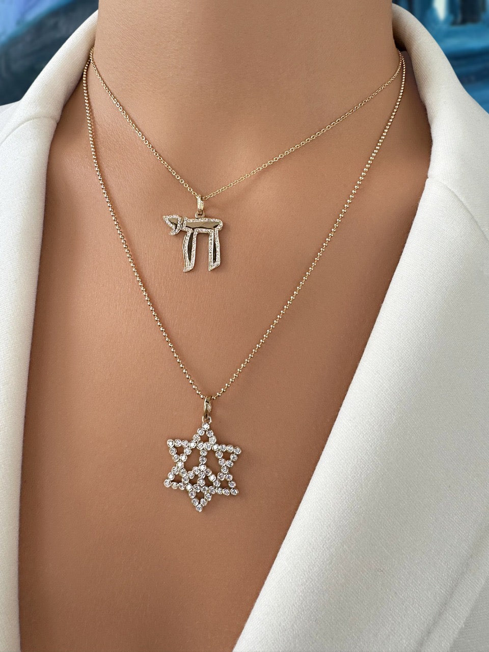 Sig Ward Jewelry 14K YG Diamond Star of David Necklace and Diamond Chai Necklace featuring brilliant diamonds set in polished 14K yellow gold symbolic pendant necklaces.
