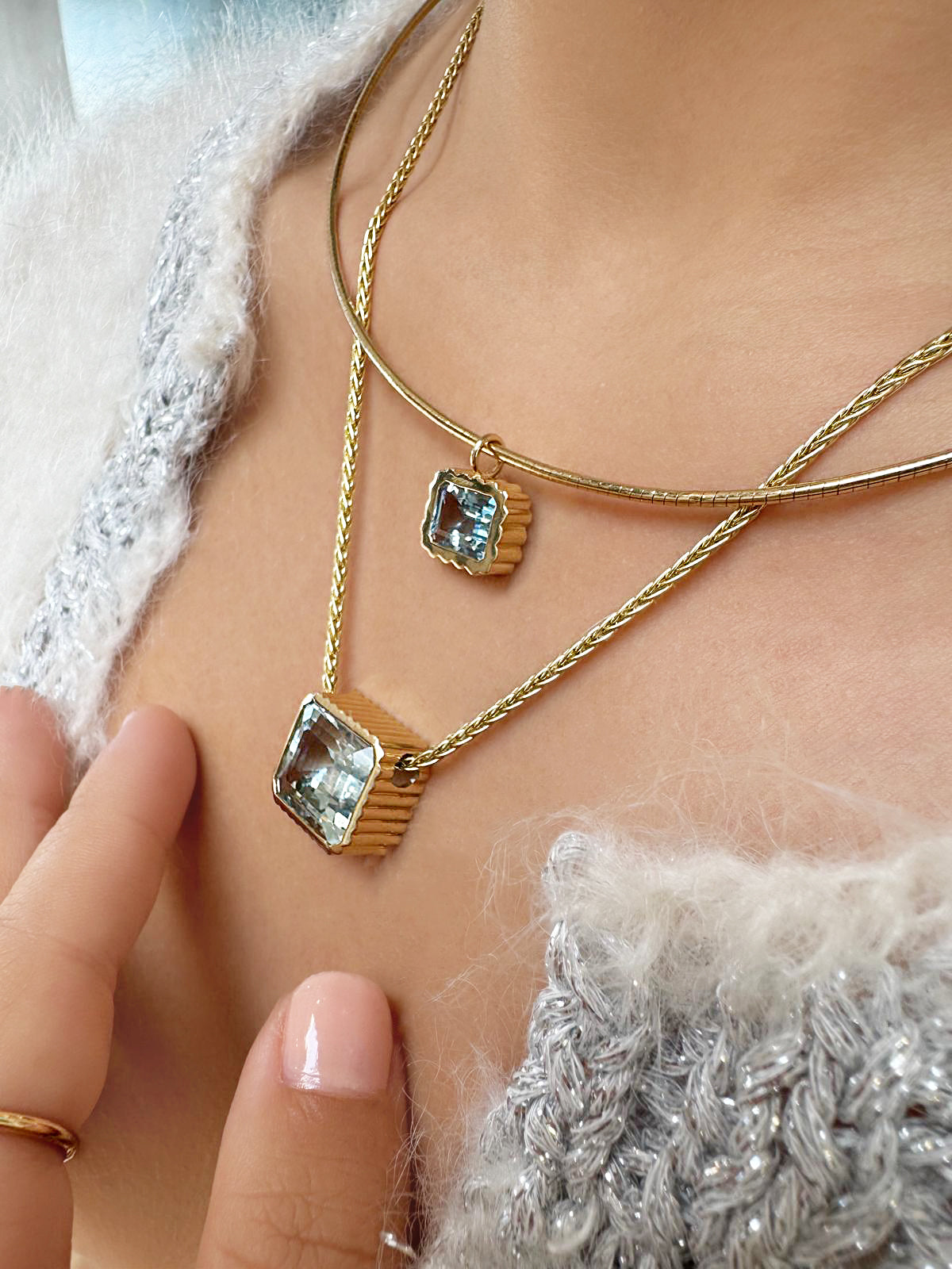 Sig Ward Jewelry Lifestyle 14K yellow gold Omega Bezel Aquamarine Necklace featuring a bezel-set aquamarine gemstone with an elegant modern luxury design.