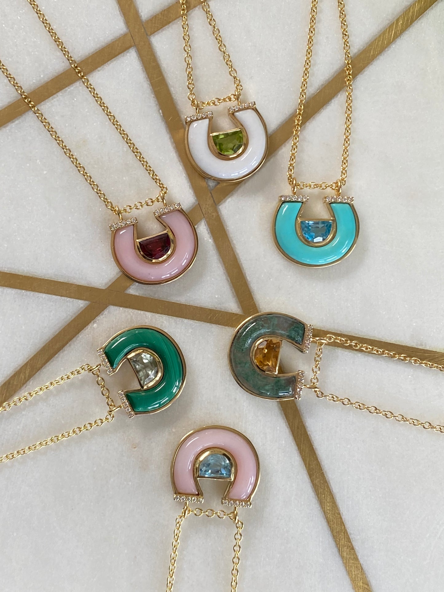 Sig Ward Jewelry 14K yellow gold Citrine, Moss Agate and Diamond Horseshoe Necklace featuring radiant citrine, natural moss agate, and brilliant diamond accents in a signature horseshoe pendant design.