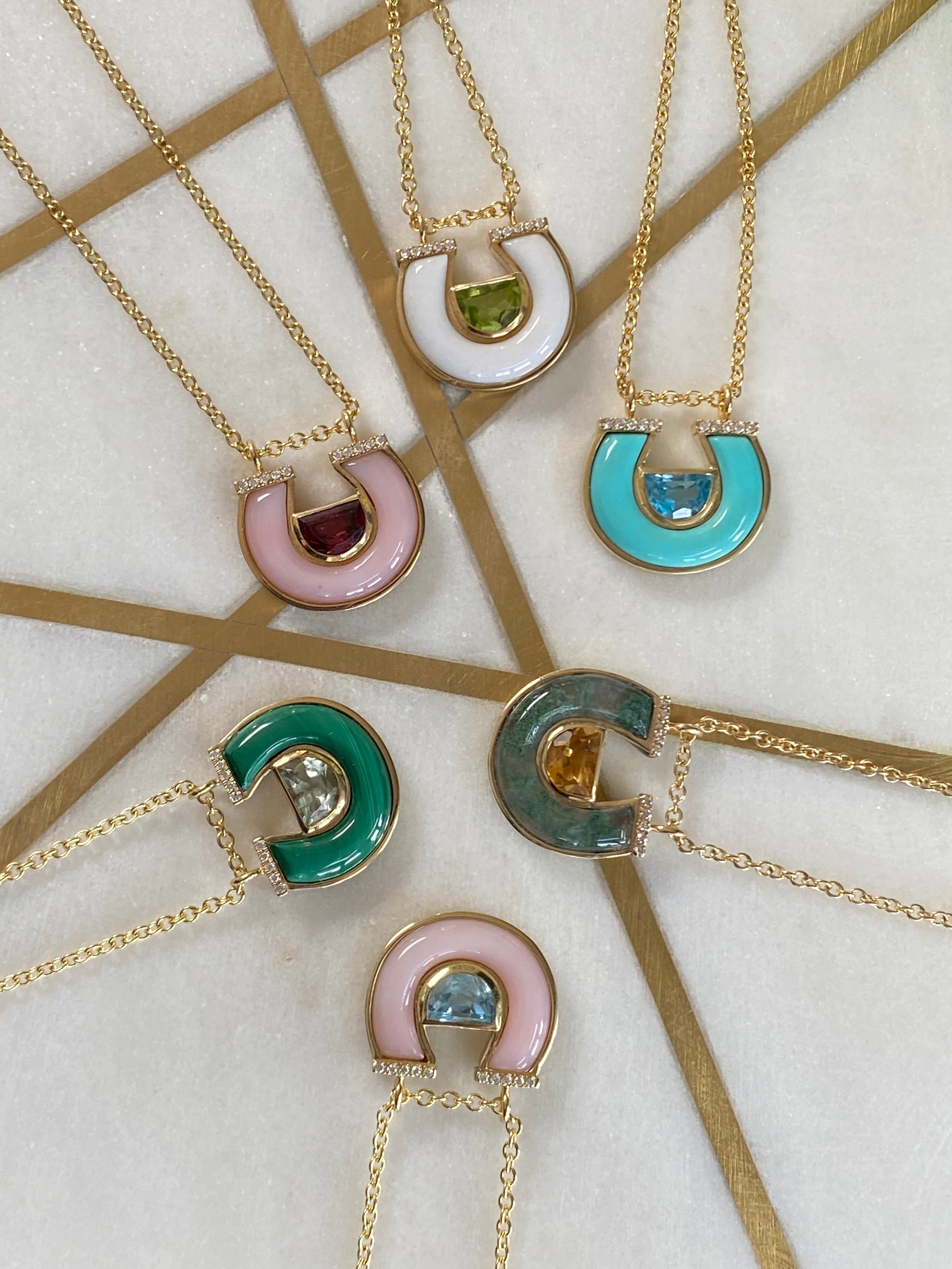 Sig Ward Jewelry 14K yellow gold Citrine, Moss Agate and Diamond Horseshoe Necklace featuring radiant citrine, natural moss agate, and brilliant diamond accents in a signature horseshoe pendant design.