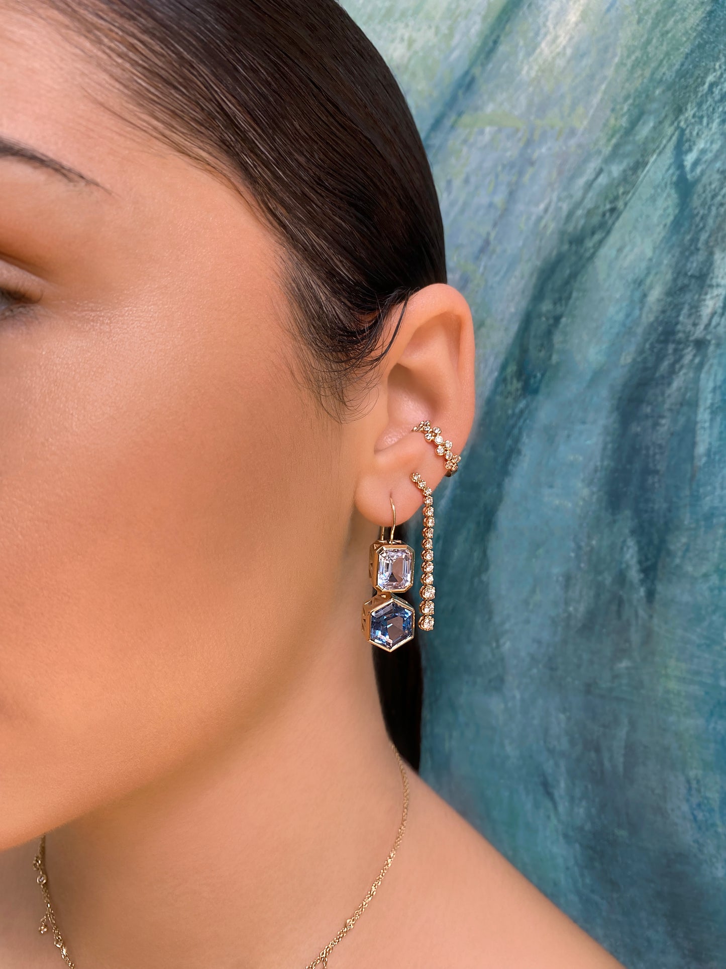 Sig Ward Jewelry Lifestyle Featuring The 14K Yellow Gold Aquamarine And Topaz Duo Earrings Showcasing Vibrant Aquamarine And Topaz Gemstones In A Modern Heirloom Design.