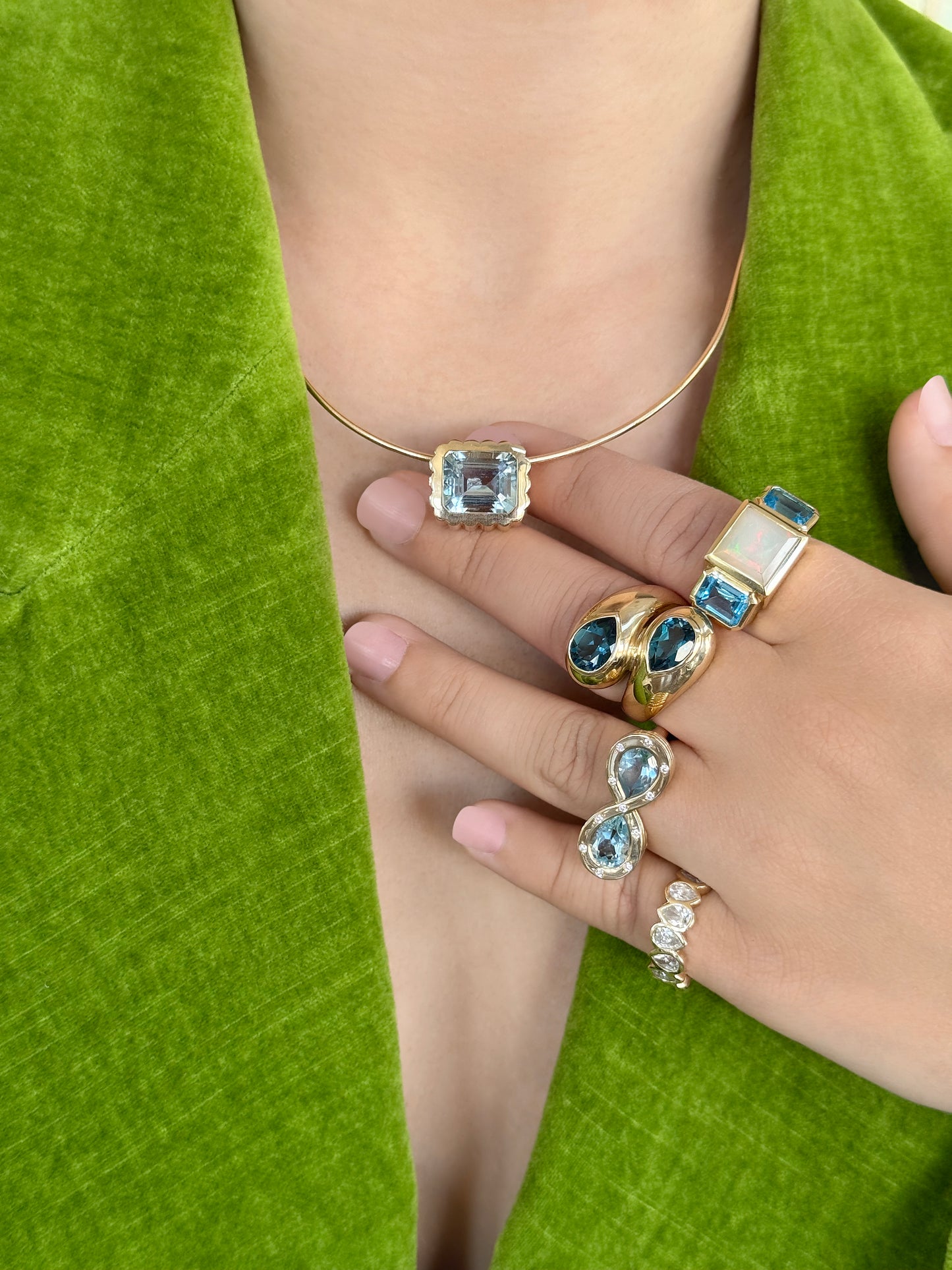 Sig Ward Jewelry 14K YG Ethiopian Opal and Topaz Trilogy Ring, Topaz and Diamond Infinity Ring, and London Topaz Toi et Moi Ring featuring elegant gemstone designs with luxurious yellow gold settings and diamond accents.
