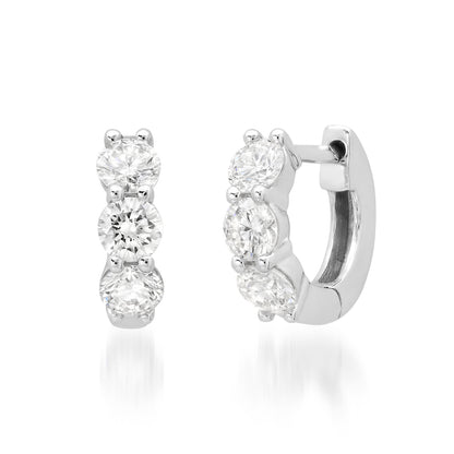 Sig Ward Jewelry 14K White Gold Emma Diamond Huggies featuring round brilliant diamonds set in polished 14K white gold huggie hoop earrings.