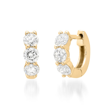 Sig Ward Jewelry 14K YG Emma Diamond Huggies featuring round brilliant diamonds set in polished 14K yellow gold huggie hoop earrings.