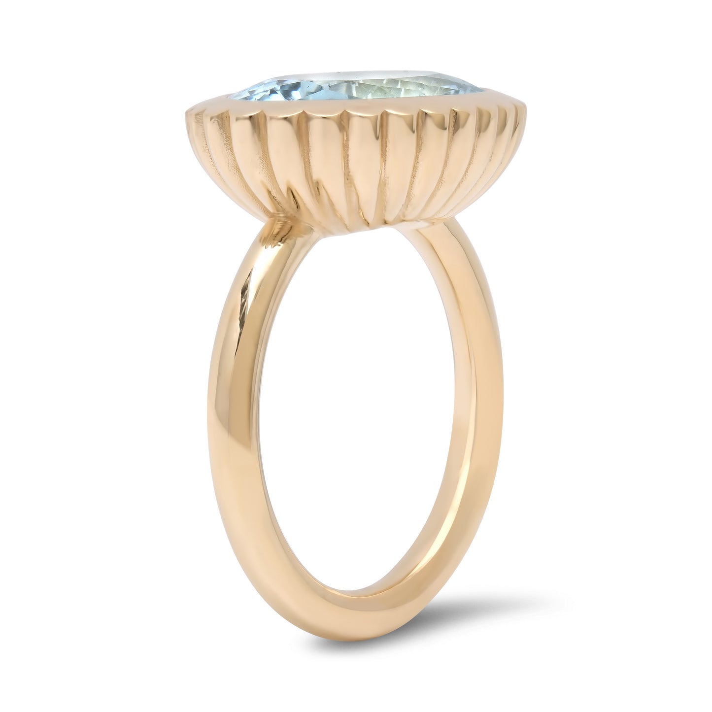 Side view of the 14K yellow gold Aquamarine Omega Ring by Sig Ward Jewelry, featuring a natural aquamarine gemstone in a modern sculptural Omega design.