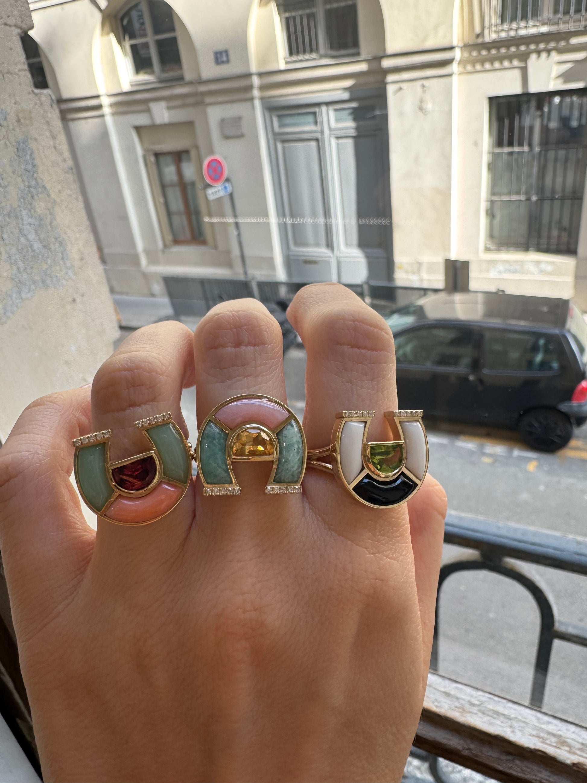 Sig Ward Jewelry 14K yellow gold Horseshoe Rings featuring colorful natural gemstones and brilliant diamonds in elegant, symbolic fine jewelry designs.