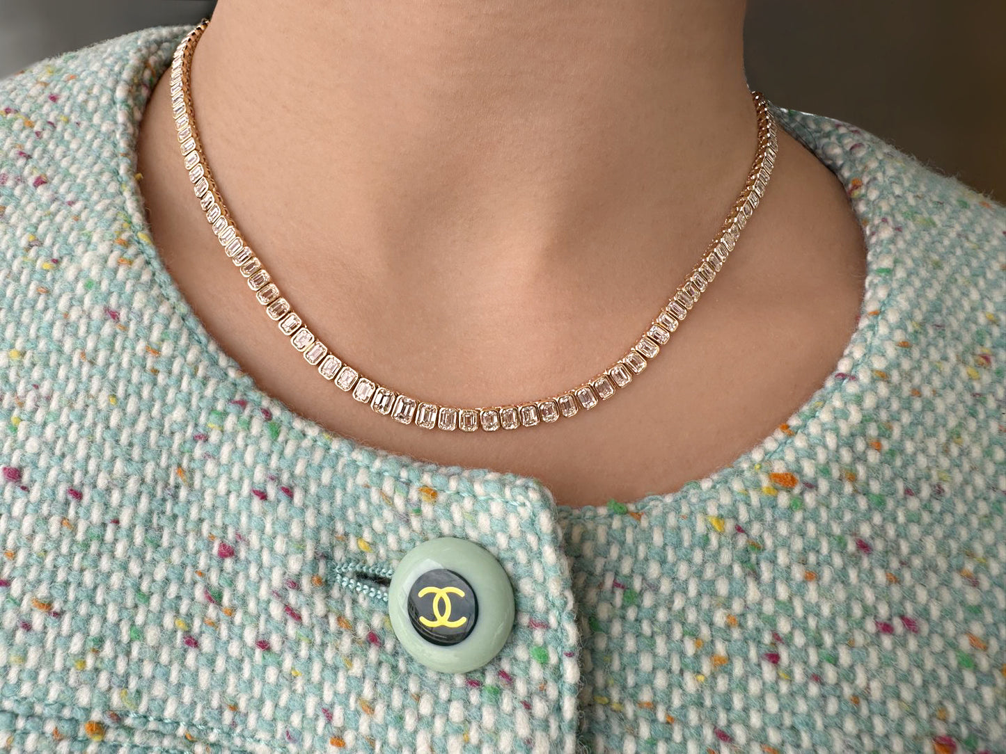 14K yellow gold emerald-cut diamond tennis necklace featuring graduated emerald-cut white diamonds by Sig Ward Jewelry.