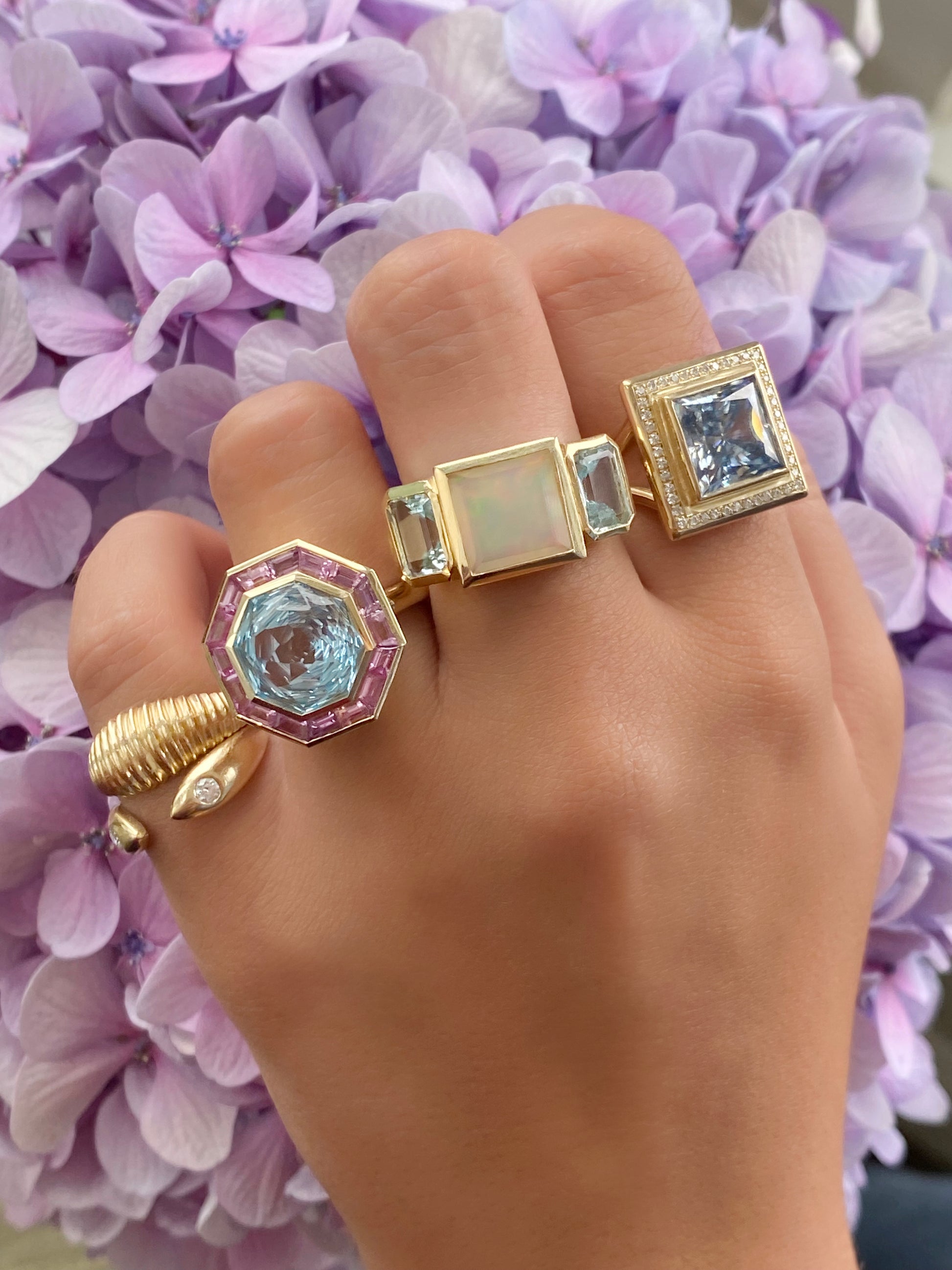 14K Yellow Gold Trilogy Ring Featuring Ethiopian Opal And Aquamarine By Sig Ward Jewelry.