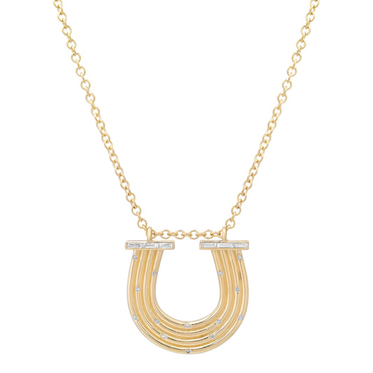 Close-up view of the 14K yellow gold Large Slim Reeded Baguette Diamond Horseshoe Necklace by Sig Ward Jewelry, showcasing natural baguette and round diamond accents, refined reeded detailing, and an elegant horseshoe pendant design.