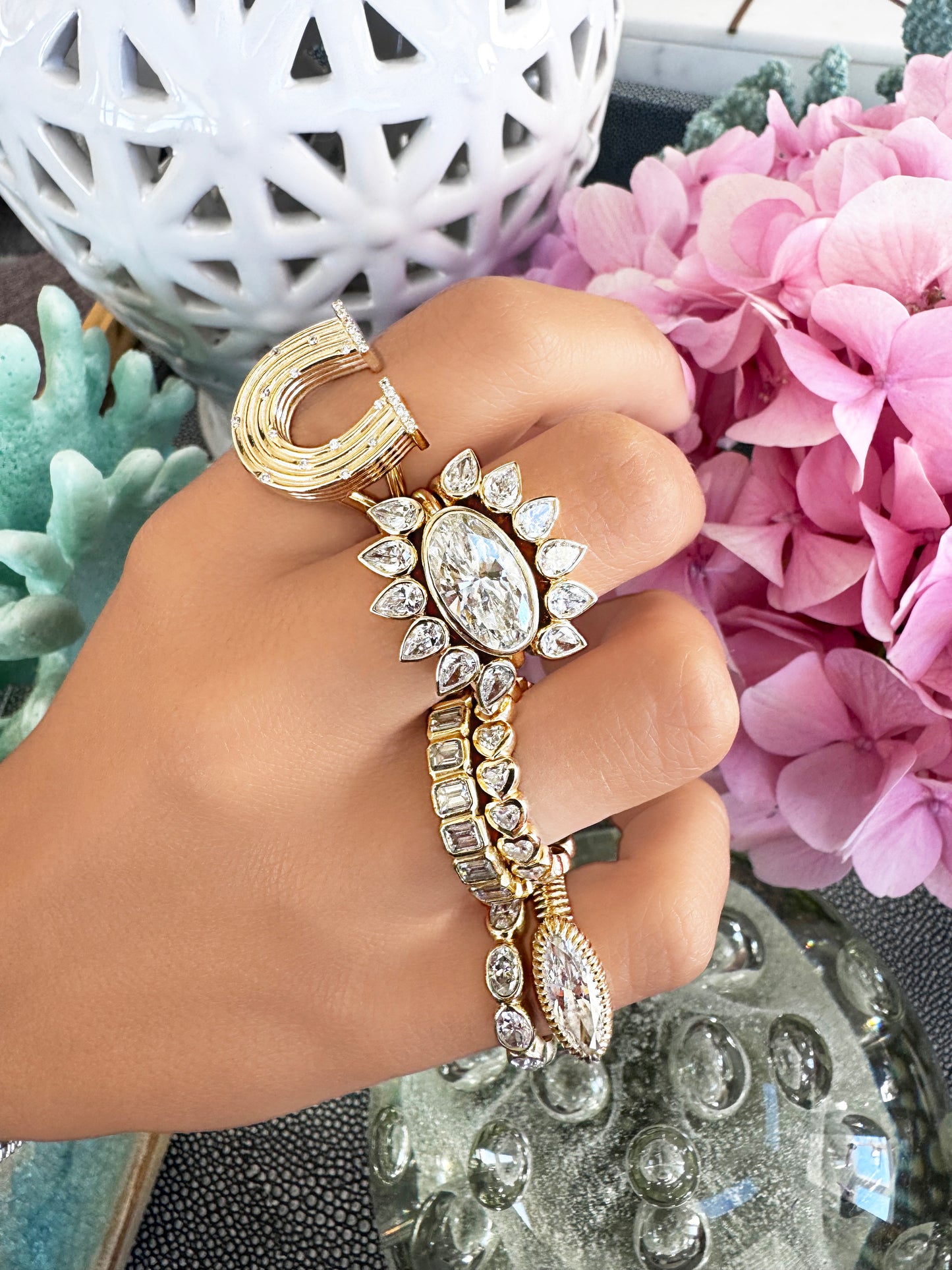 Sig Ward Jewelry 14K Yellow Gold Reeded Gold with Diamond Horseshoe Ring, Pear shape with diamond snake ring on model