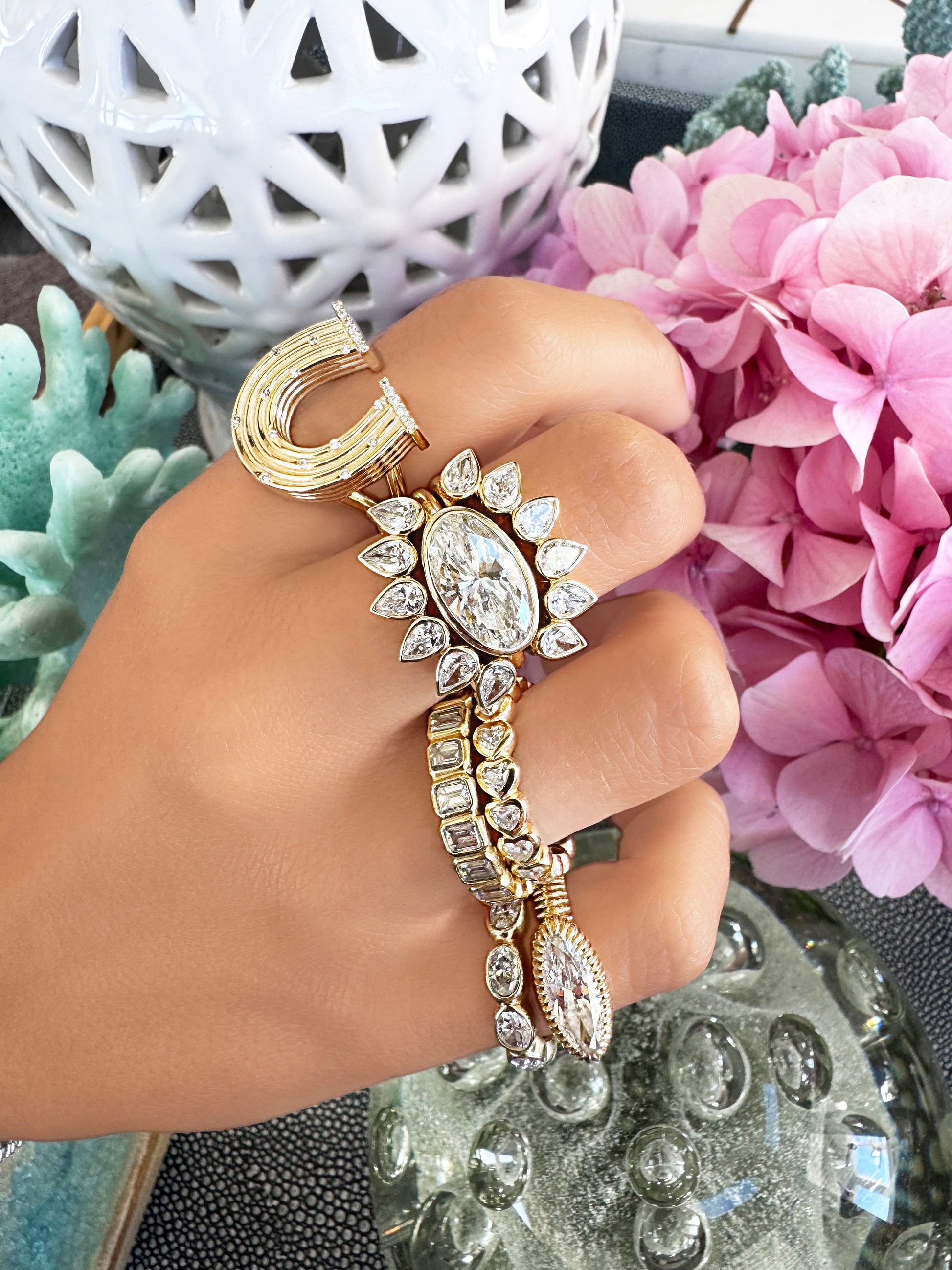 Sig Ward Jewelry 14K Yellow Gold Reeded Gold with Diamond Horseshoe Ring, Pear shape with diamond snake ring on model