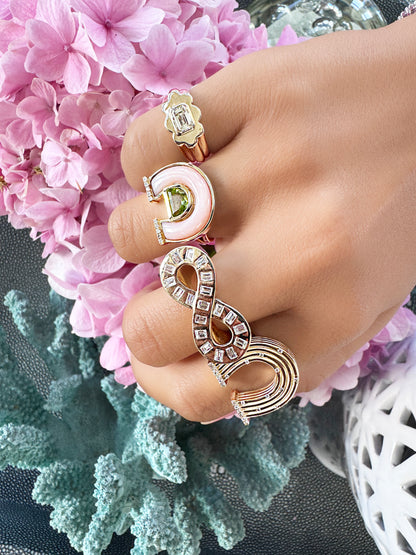 Sig Ward Jewelry 14K Yellow Gold Emerald Cut Diamond Pinky Ring, Horseshoe Pink with Pear Shape ring, Horseshoe with scattered diamond ring on model