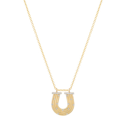 Close-up view of the 14K yellow gold Slim Reeded Diamond Horseshoe Necklace by Sig Ward Jewelry, featuring natural diamond accents, refined reeded detailing, and an elegant horseshoe pendant design.