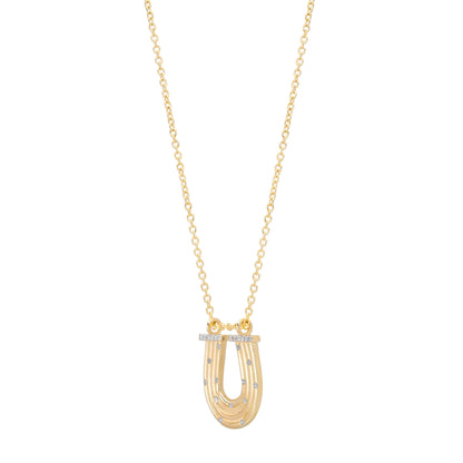 Close-up view of the 14K yellow gold Slim Reeded Diamond Horseshoe Necklace by Sig Ward Jewelry, highlighting natural diamond accents, refined reeded detailing, and the elegant horseshoe pendant craftsmanship.