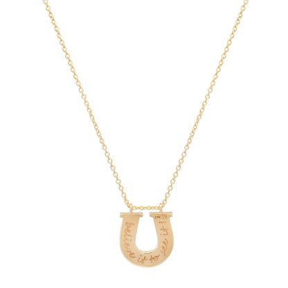 Close-up view of the 14K yellow gold Slim Reeded Diamond Horseshoe Necklace by Sig Ward Jewelry, showcasing natural diamond accents, fine reeded detailing, and an elegant horseshoe pendant design.