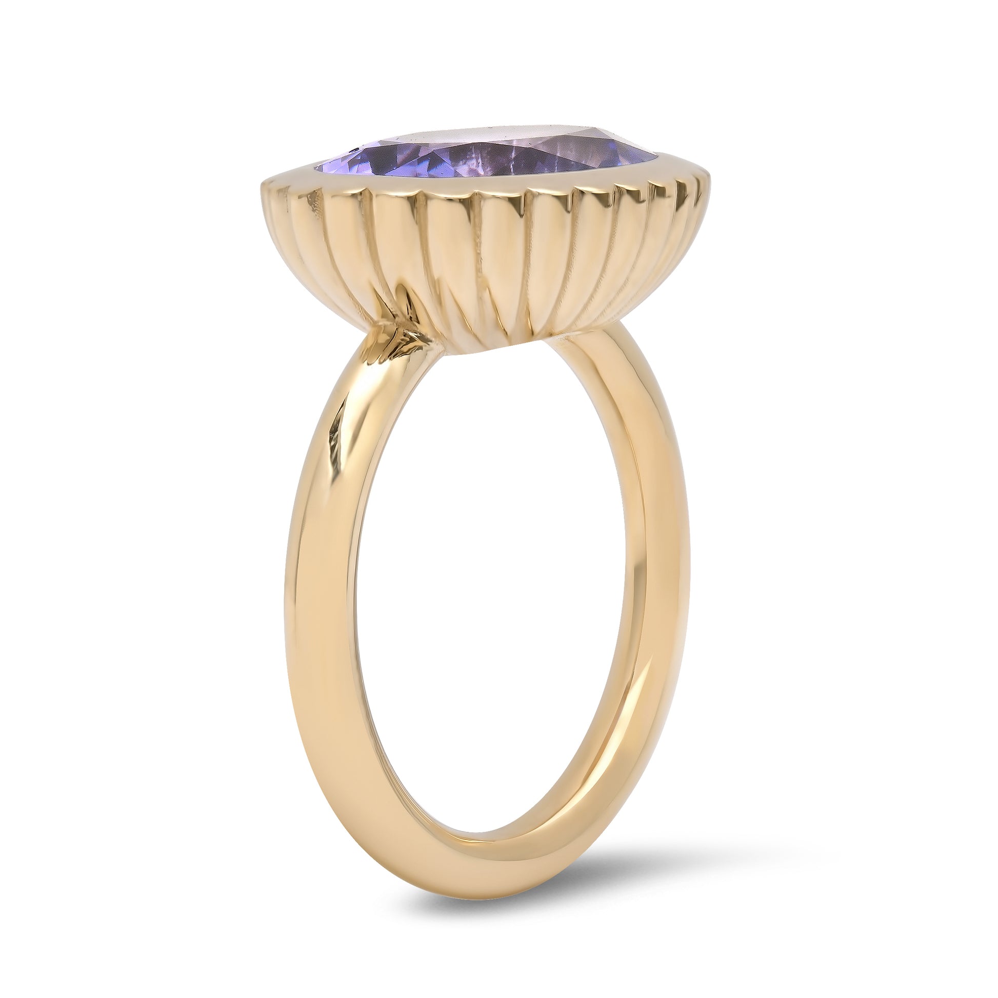 Side view of the 14K yellow gold Tanzanite Omega Ring by Sig Ward Jewelry, featuring a natural tanzanite gemstone in a sculptural Omega design.