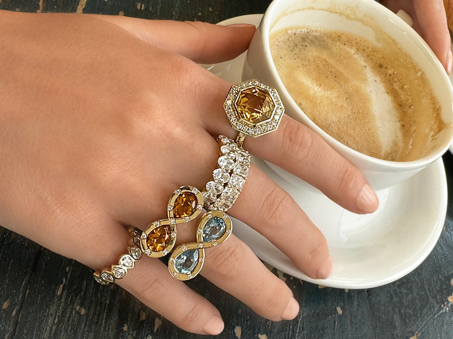 Sig Ward Jewelry 14K Yellow Gold Topaz and Diamond Infinity Ring and 14K Yellow Gold Citrine and Diamond Infinity Ring on model