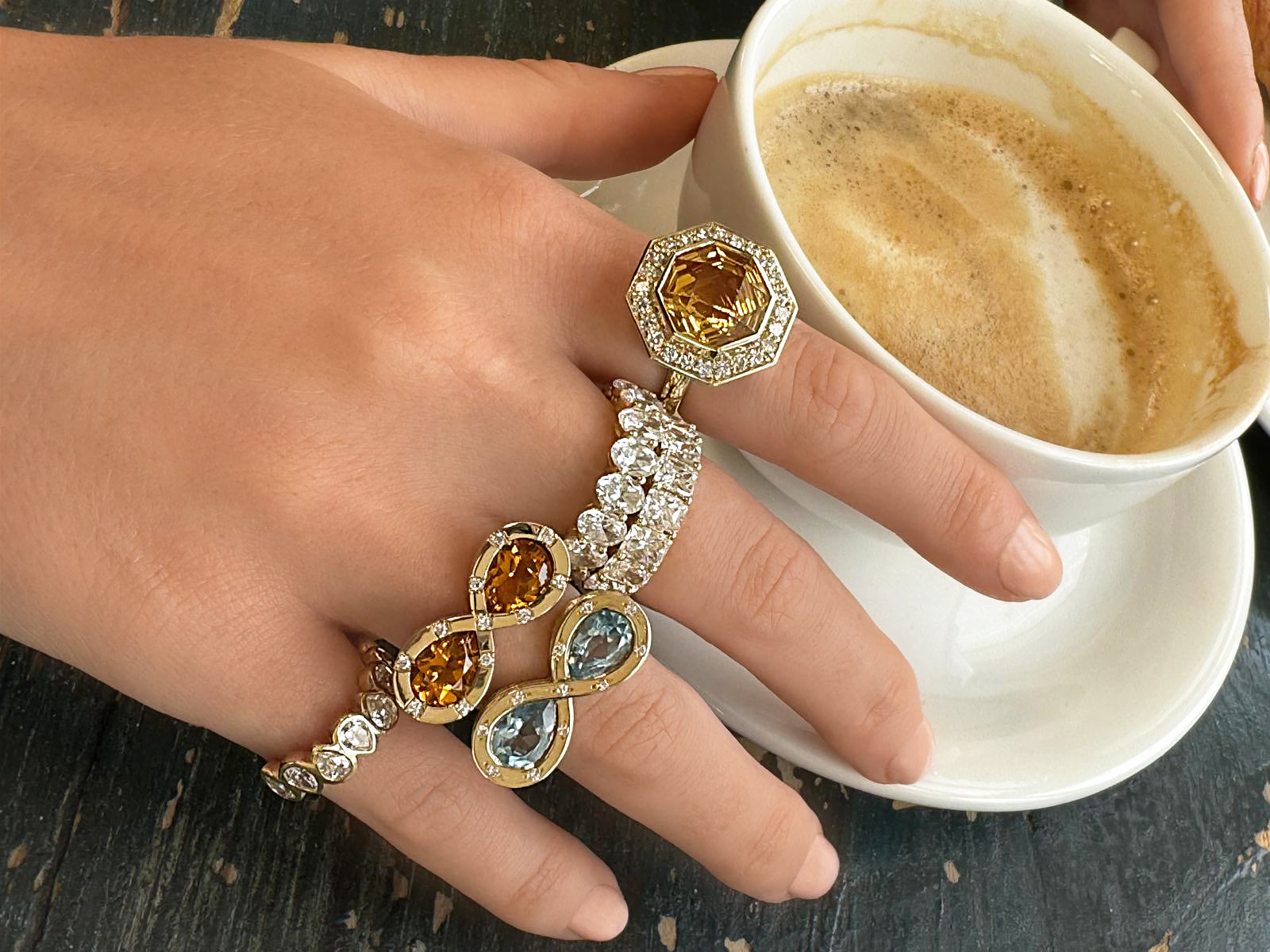 Sig Ward Jewelry 14K Yellow Gold Topaz and Diamond Infinity Ring and 14K Yellow Gold Citrine and Diamond Infinity Ring on model