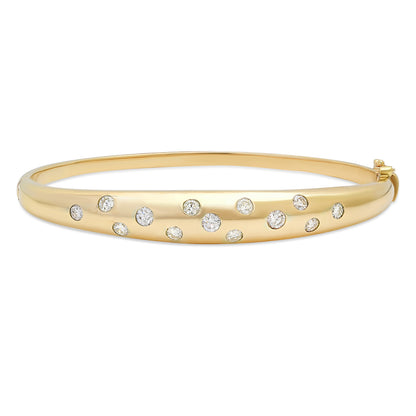 Close-up view of the Sig Ward Jewelry 14K Yellow Gold Wide Gypsy Set Diamond Bangle showcasing flush-set brilliant diamonds in a polished wide 14K yellow gold bangle with a sleek, timeless design.