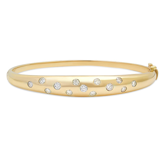 Close-up view of the Sig Ward Jewelry 14K Yellow Gold Wide Gypsy Set Diamond Bangle showcasing flush-set brilliant diamonds in a polished wide 14K yellow gold bangle with a sleek, timeless design.