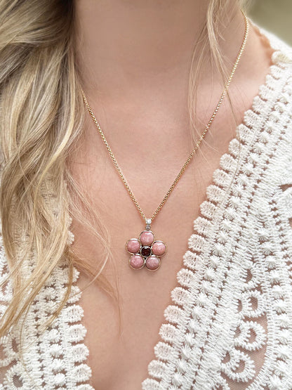 Lifestyle image featuring the 14K yellow gold Pink Opal, Pink Tourmaline, and Diamond Blossom Necklace by Sig Ward Jewelry, showcasing natural pink opal, pink tourmaline, and diamond accents in an elegant floral-inspired necklace design.