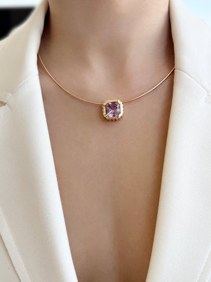 Sig Ward Jewelry Lifestyle 14K YG Amethyst Omega Necklace featuring a rich amethyst gemstone set in polished yellow gold with a sleek omega necklace design for an elegant luxury jewelry statement