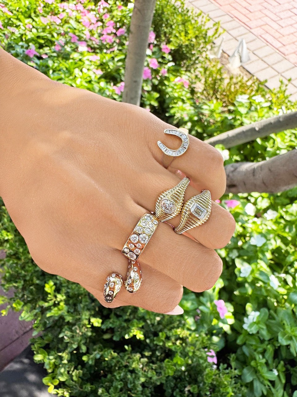 Sig Ward Jewelry Lifestyle 14K yellow gold Criss Cross Gypsy Set Diamond Ring featuring a modern criss cross design with gypsy-set diamonds.