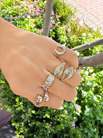 Sig Ward Jewelry Lifestyle 14K yellow gold Criss Cross Gypsy Set Diamond Ring featuring a modern criss cross design with gypsy-set diamonds.