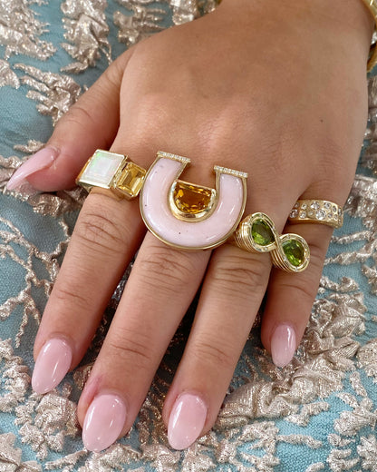 Lifestyle image of Sig Ward Jewelry 14K yellow gold Ethiopian Opal and Citrine Trilogy Ring featuring natural Ethiopian opal and citrine gemstones, showcasing handcrafted luxury fine jewelry with a modern heirloom-inspired design.