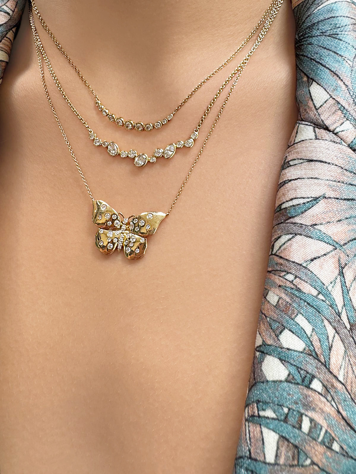 Lifestyle image featuring the 14K yellow gold Lyla Multi Shape Diamond Bib Necklace by Sig Ward Jewelry, showcasing natural multi-shaped diamonds in a luxurious statement bib necklace design.