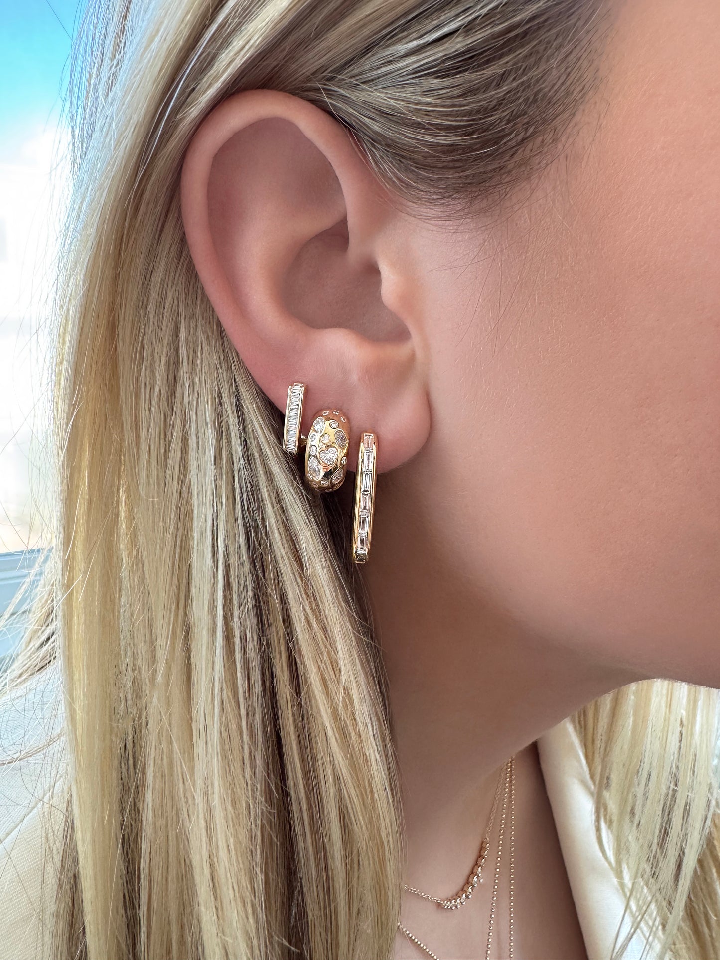 Sig Ward Jewelry 14K YG Mixed Diamond Gypsy Earrings, 14K YG Reva Baguette Diamond Huggies, and 18K YG Brooke Baguette Diamond Earrings featuring brilliant and baguette cut diamonds in polished yellow gold designs.