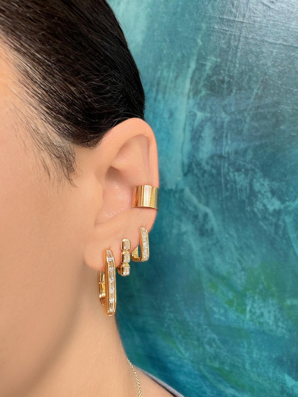 Sig Ward Jewelry 14K YG Reva and Rowan Baguette Diamond Huggies featuring baguette cut diamonds set in polished yellow gold huggie hoop earrings.