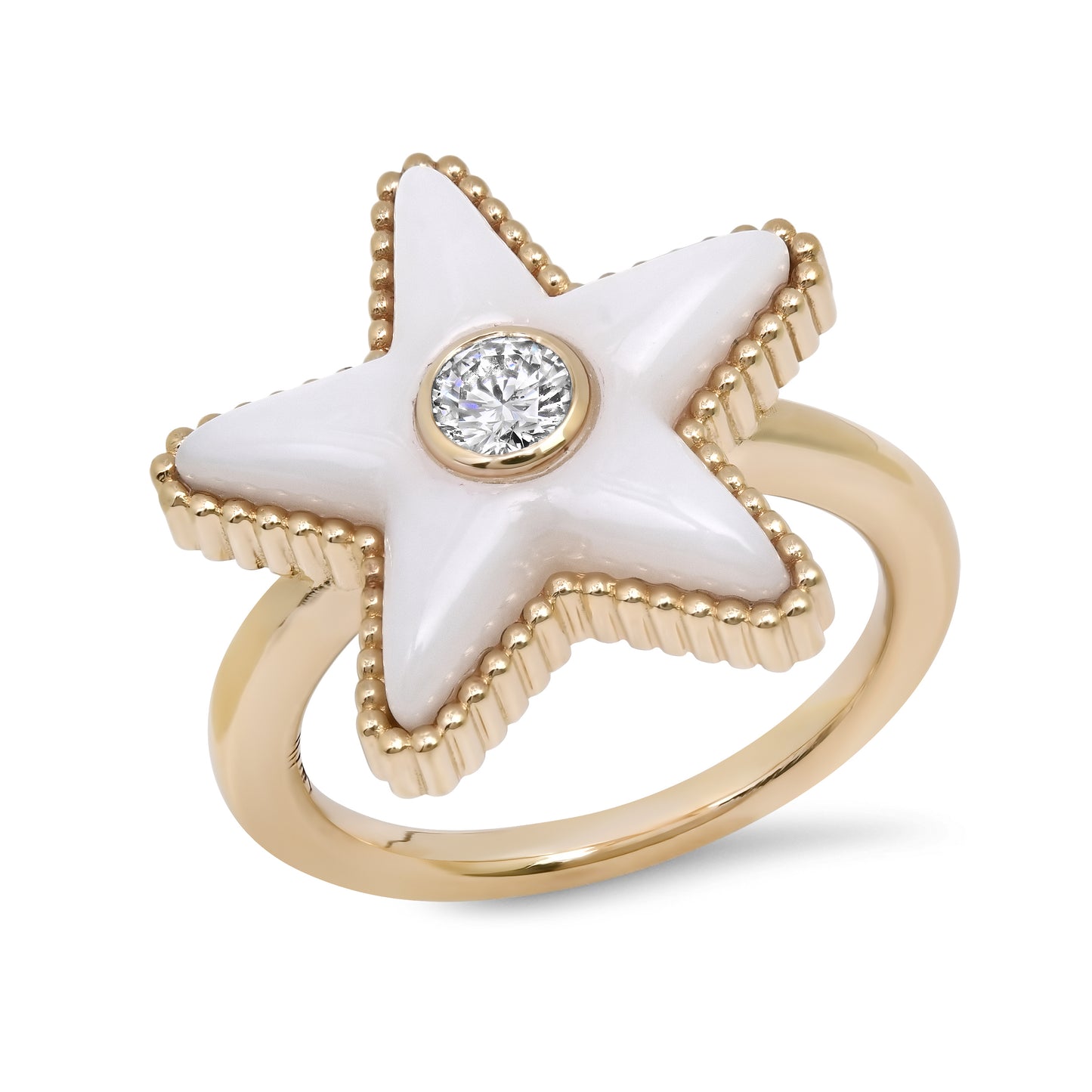 Sig Ward Jewelry Gold ring with a white star-shaped stone and a clear gemstone at its center on a white background