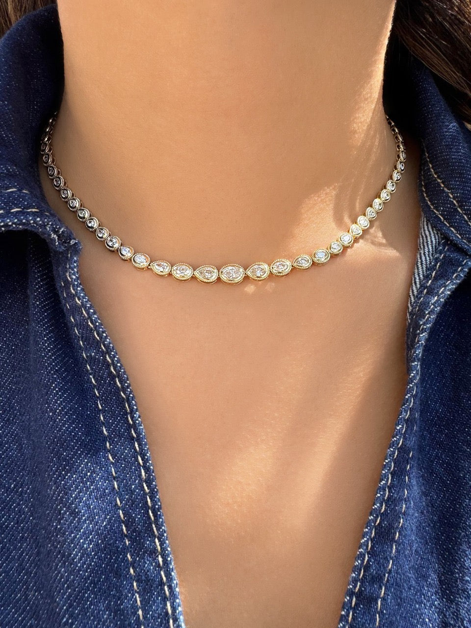 Sig Ward Jewelry Lifestyle 14K Yellow Gold Maven Oval and Pear Shape Diamond Tennis Necklace featuring alternating oval and pear shape diamonds styled for a modern luxury look.