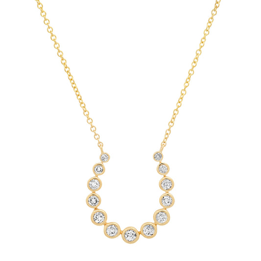 Sig Ward Jewelry 14K yellow gold horseshoe necklace featuring sparkling diamond accents, a luxury fine jewelry piece with an elegant design symbolizing luck, protection, and timeless beauty.