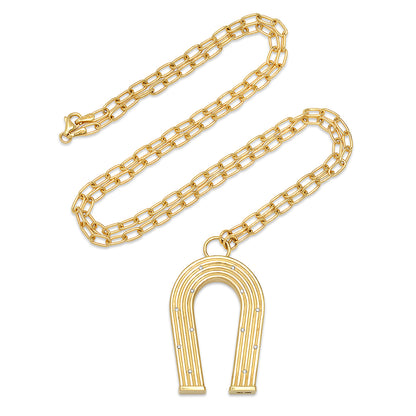 Sig Ward Jewelry 14K yellow gold horseshoe necklace featuring diamond accents and reeded gold detailing, a luxury fine jewelry piece with an elegant design symbolizing luck, protection, and timeless beauty.